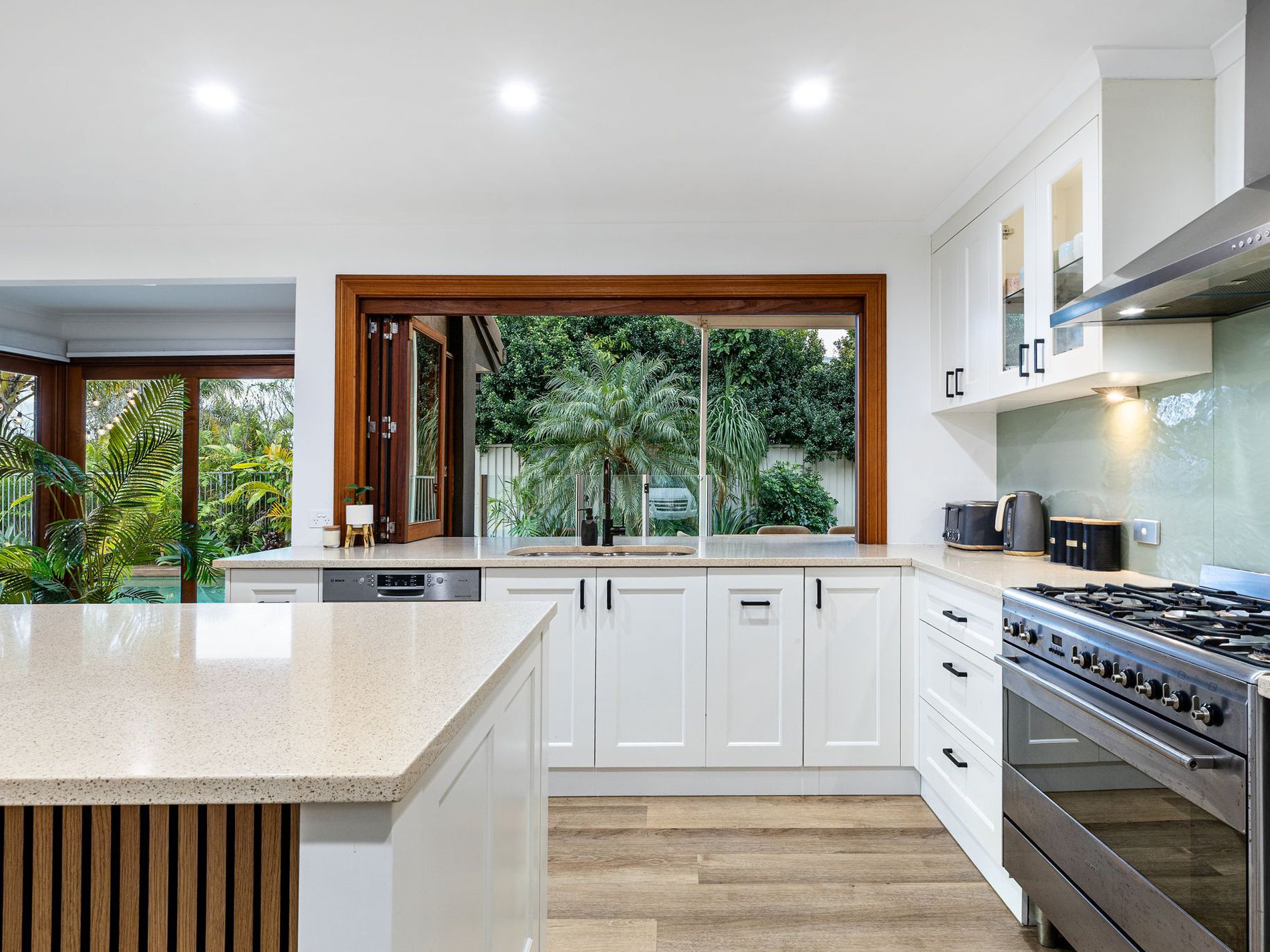 Updated kitchen with new handles, tapware, timber detailing and warmer flooring