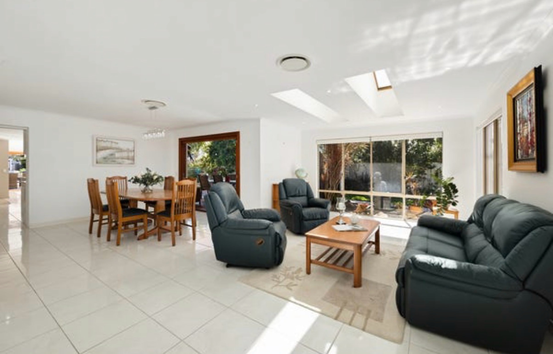 Original living area with a structural wall interrupting the view to the canal